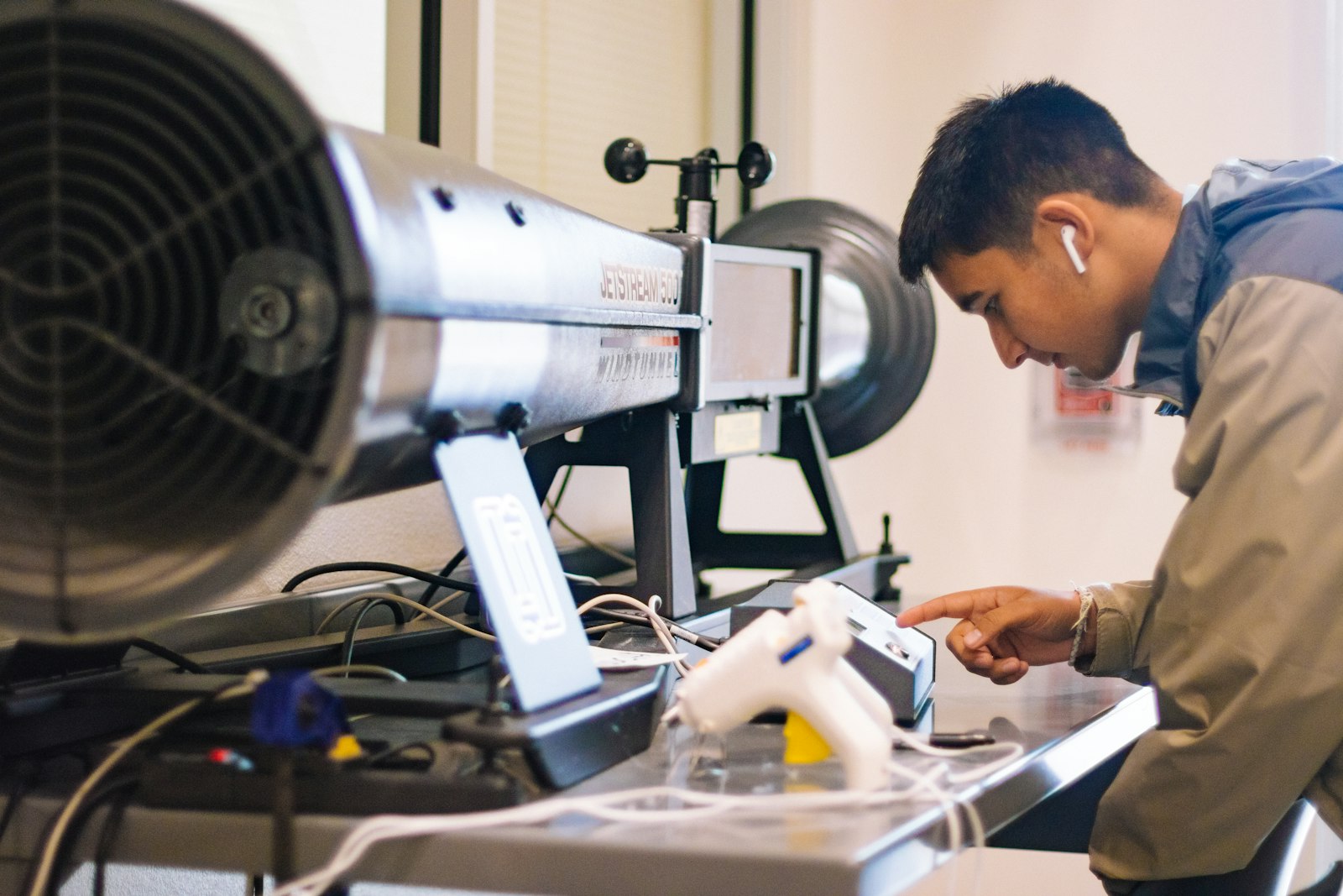 Technician servicing commercial ventilation equipment